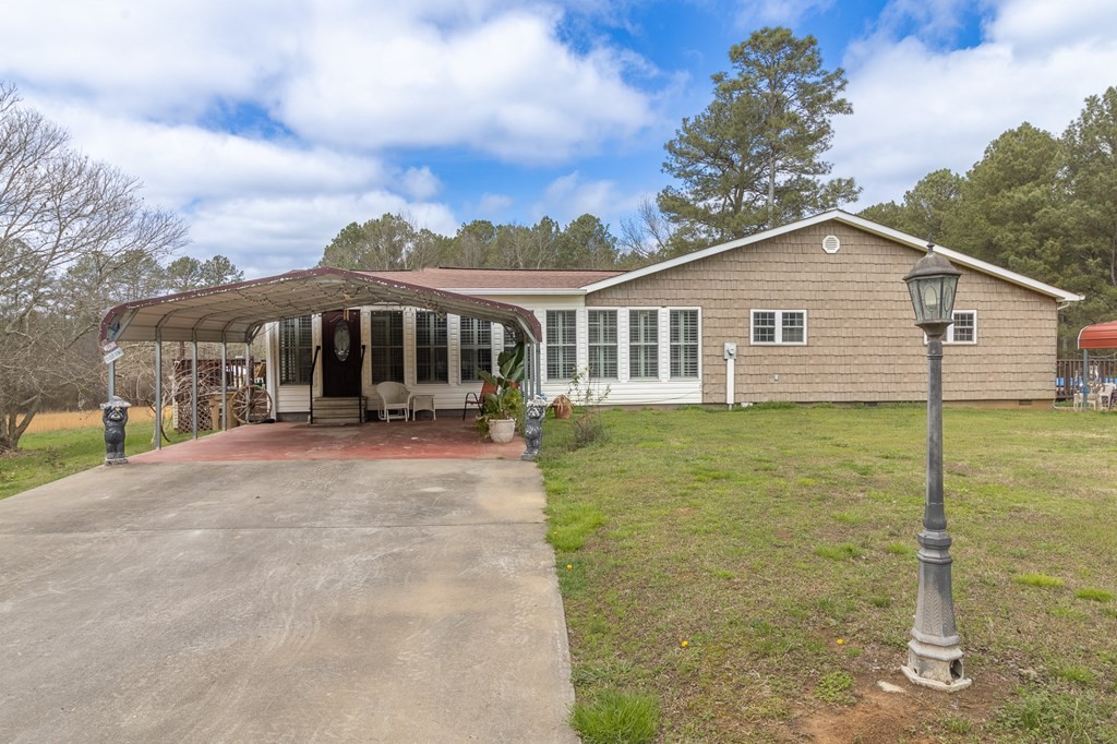 374 Allen Road West Chatsworth, GA 30705 - Photo 2 of 28 a view of a house with a backyard
