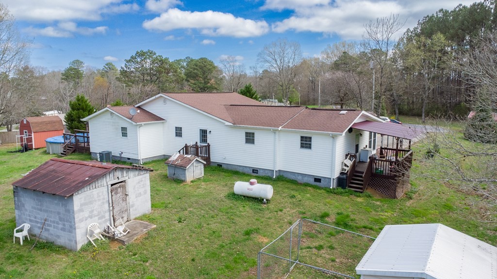374 Allen Road West Chatsworth, GA 30705 - Photo 23 of 28 a view of a house with patio and a yard