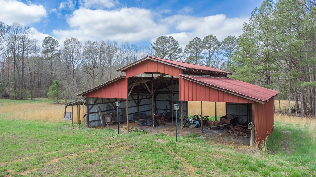 374 Allen Road West Chatsworth, GA 30705 - Photo 26 of 28 a view of a house with a yard table and chair