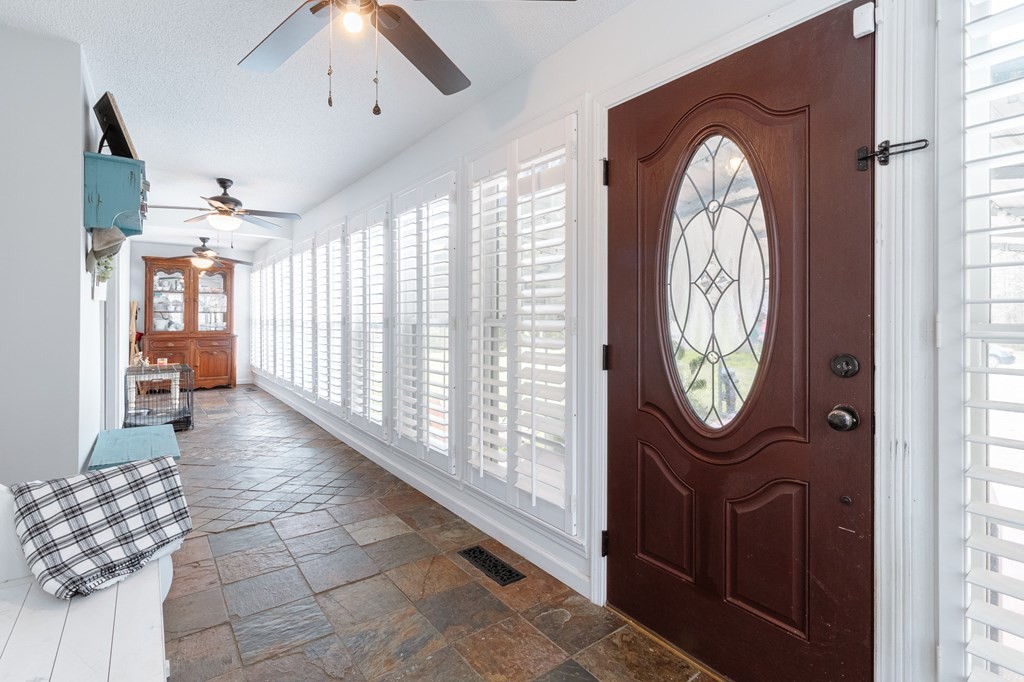 374 Allen Road West Chatsworth, GA 30705 - Photo 3 of 28 a view of a hallway with entryway wooden floor and a chandelier