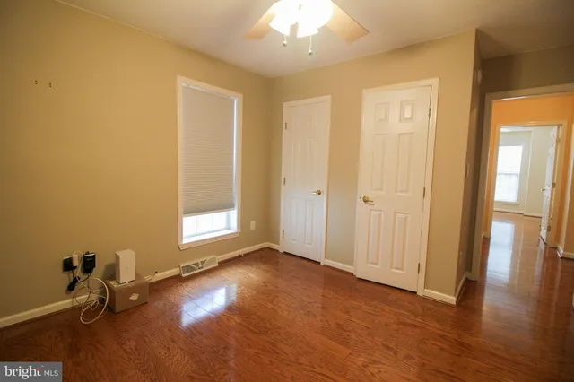 a kitchen with stainless steel appliances granite countertop wooden cabinets a sink and a stove