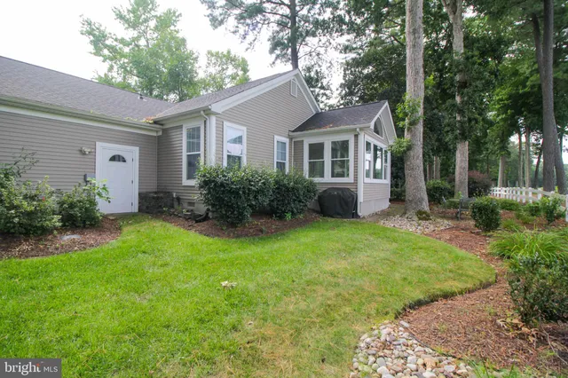 a view of a table and chairs in the garden