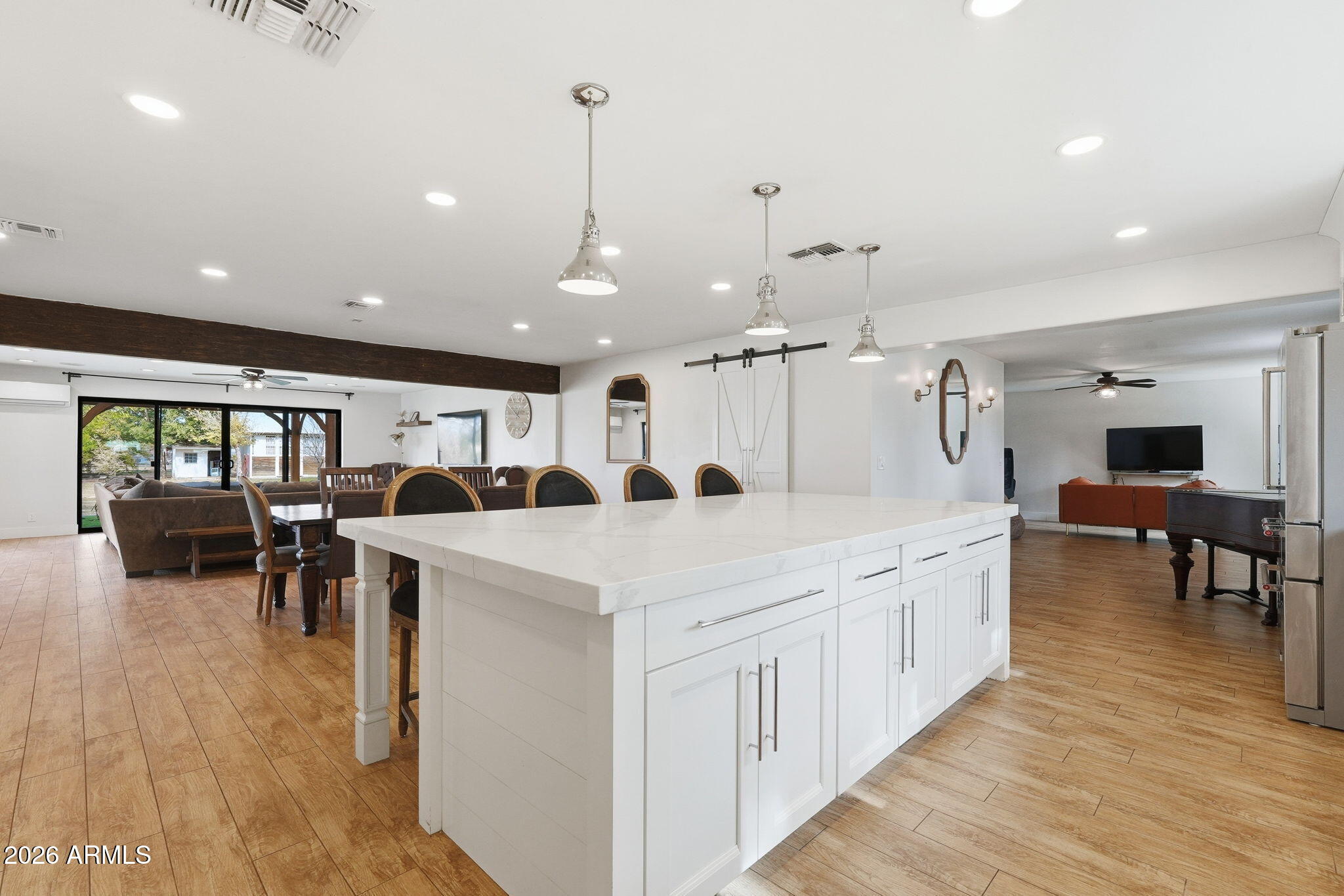 2858 East Redfield Road Gilbert, AZ 85234 - Photo 24 of 60 a large white kitchen with lots of counter space and furniture