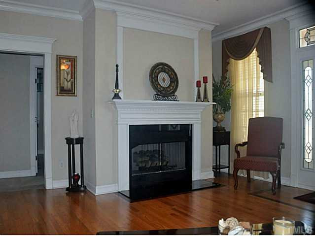17 North Sunset Ridge Drive Willow Spring, NC 27592 - Photo 4 of 18 a living room with furniture and a fireplace