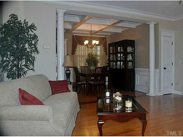 17 North Sunset Ridge Drive Willow Spring, NC 27592 - Photo 8 of 18 a living room with furniture a dining table and a potted plant