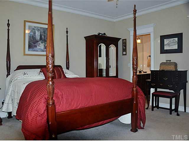 17 North Sunset Ridge Drive Willow Spring, NC 27592 - Photo 10 of 18 a bedroom with a bed and a desk