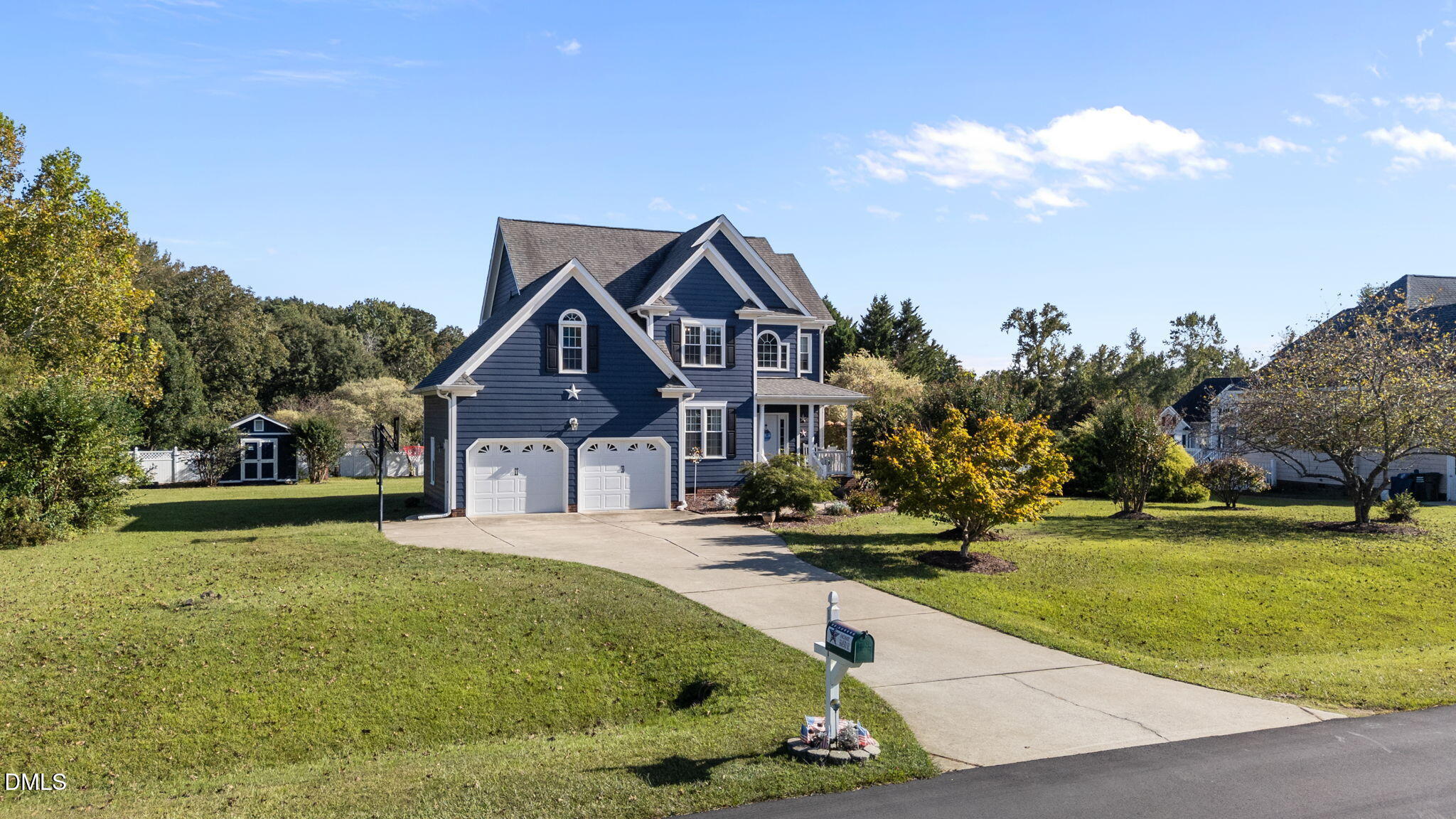 1617 Kendall Hill Road Willow Spring, NC 27592 - Photo 7 of 58 a front view of a house with garden