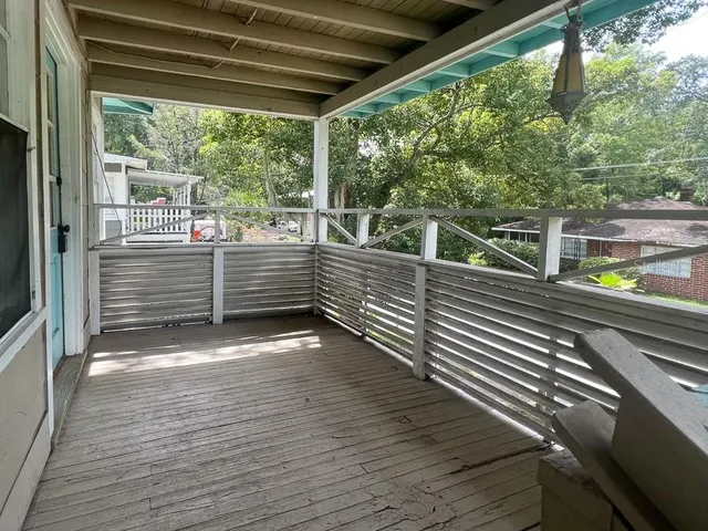 a view of a deck with wooden floor and outdoor space