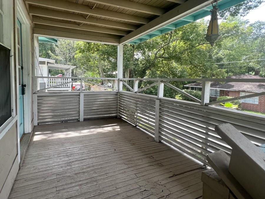 1124 Northwest 4th Avenue Gainesville, FL 32601 - Photo 2 of 16 a view of a deck with wooden floor and outdoor space