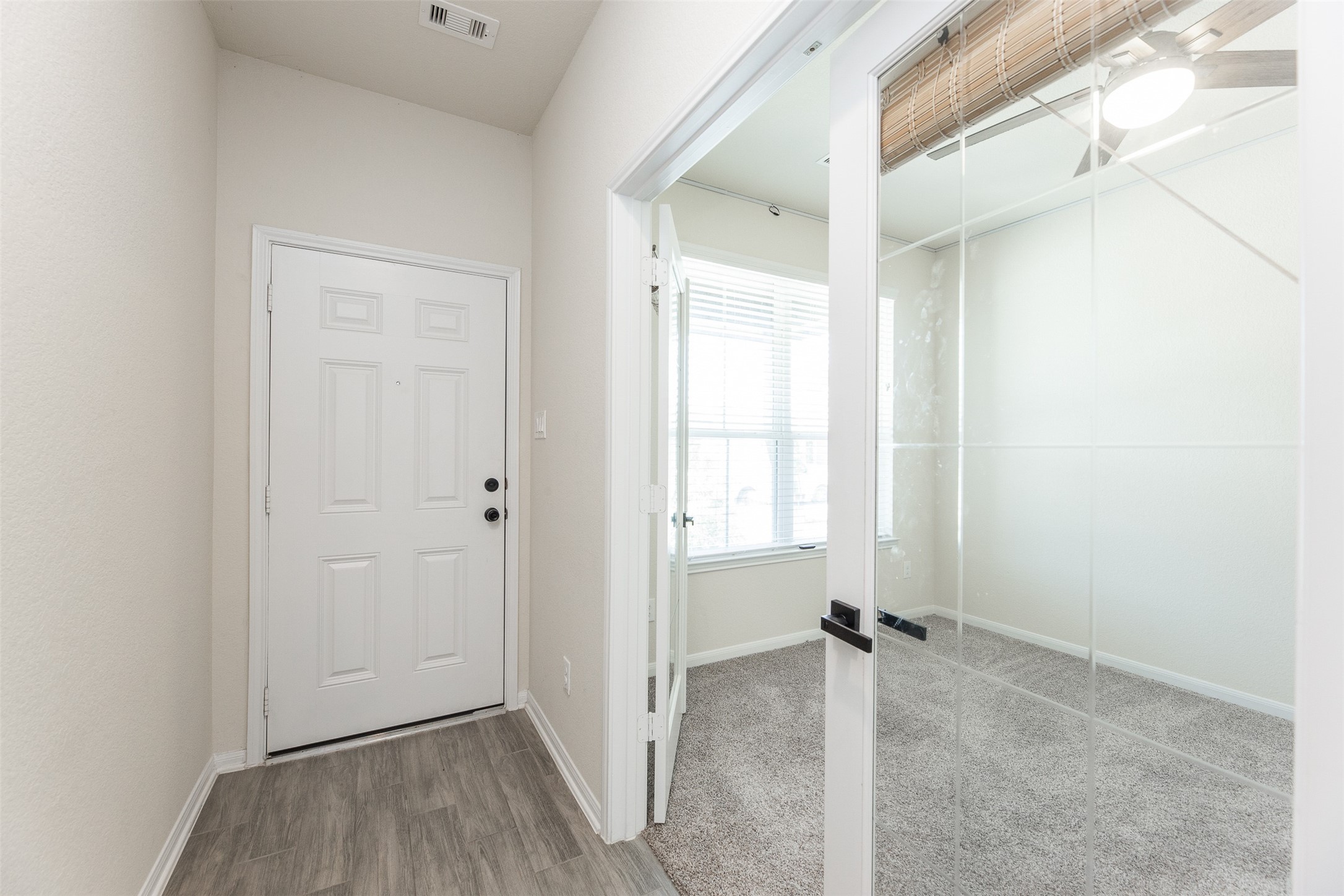 2293 Garden Square Path Spring, TX 77386 - Photo 7 of 32 a view of a room with wooden floor and a window