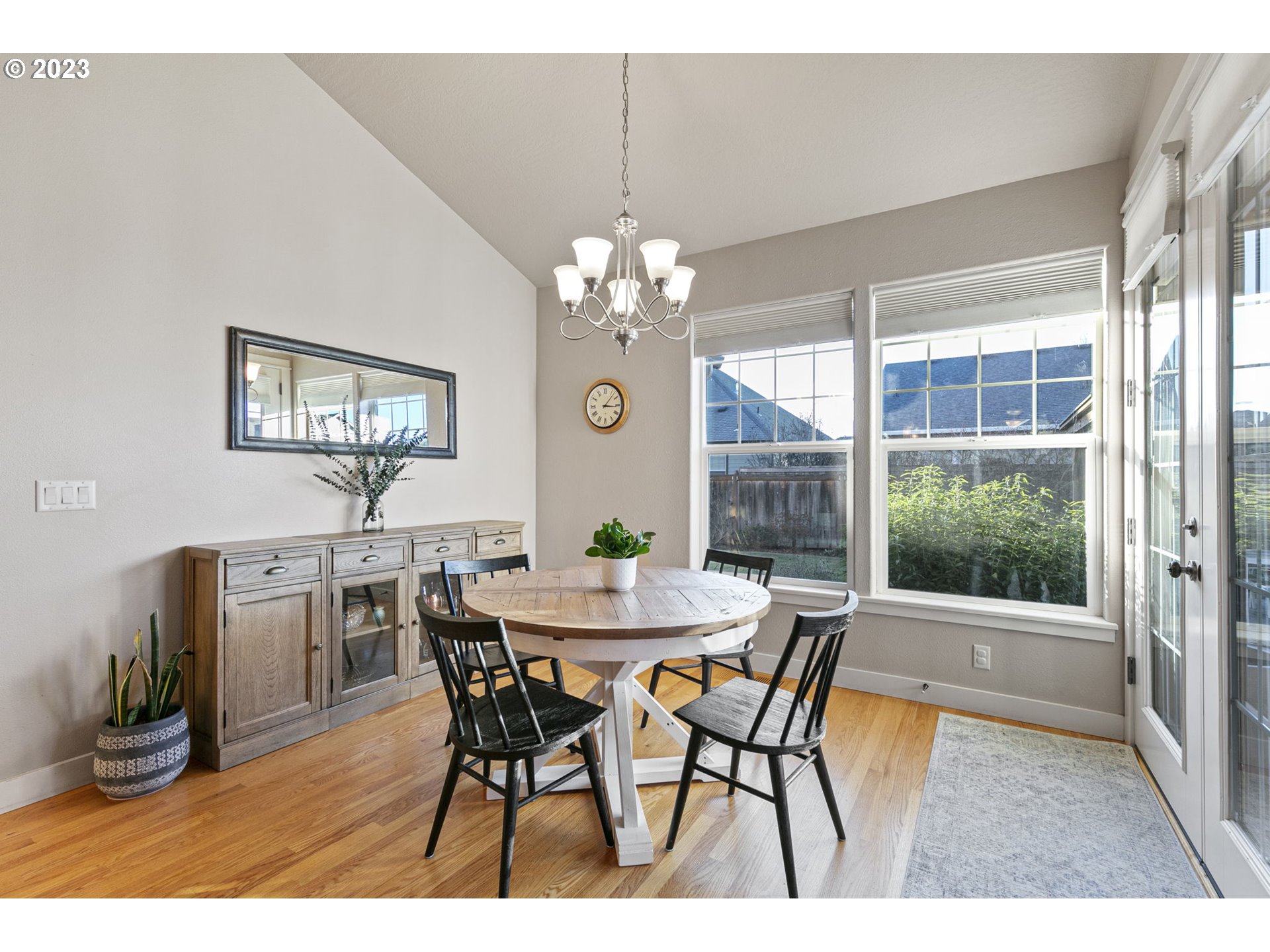 1200 South 41st Place Springfield, OR 97478 - Photo 14 of 34 a view of a dining room with furniture window and wooden floor