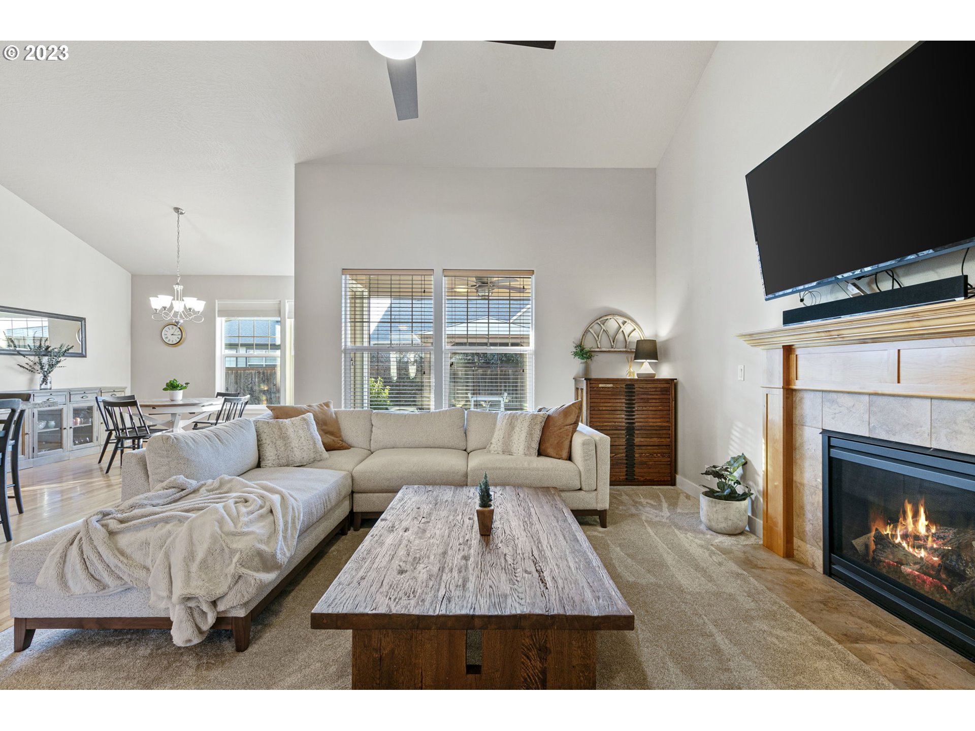 1200 South 41st Place Springfield, OR 97478 - Photo 15 of 34 a living room with furniture a fireplace and a flat screen tv
