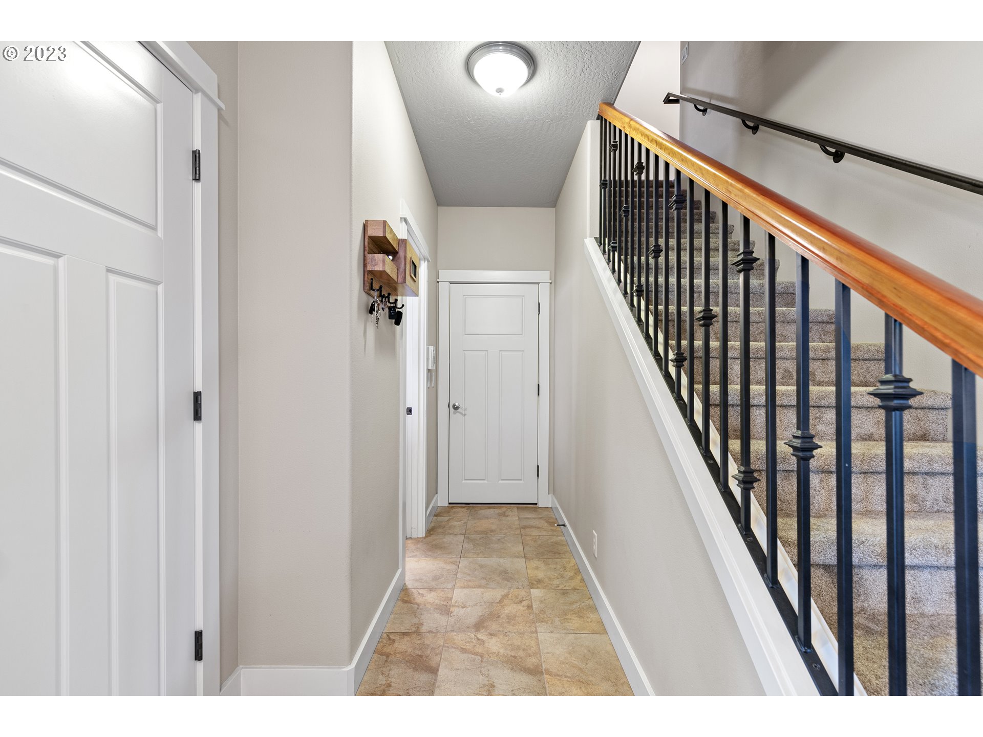 1200 South 41st Place Springfield, OR 97478 - Photo 18 of 34 a view of a hallway with wooden floor and staircase