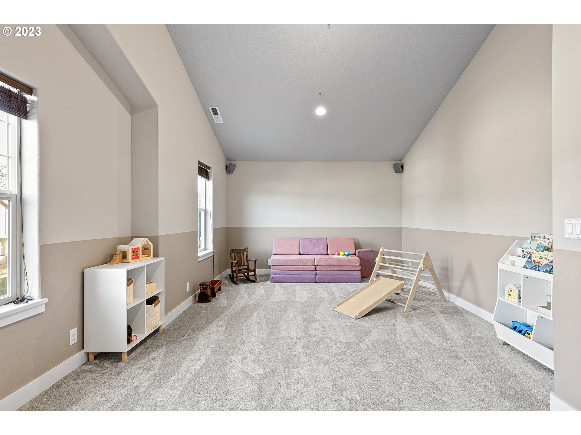 1200 South 41st Place Springfield, OR 97478 - Photo 23 of 34 a living room with a couch and a dresser next to a window