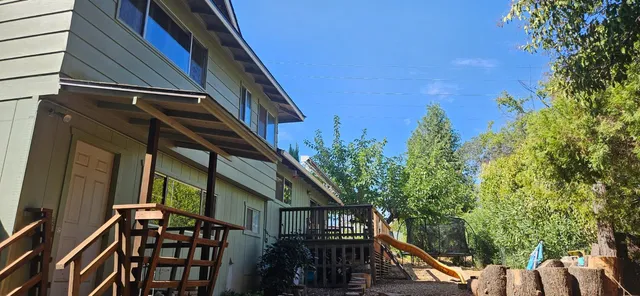 a view of a house with a tree