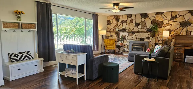 a bedroom with furniture and wooden floor