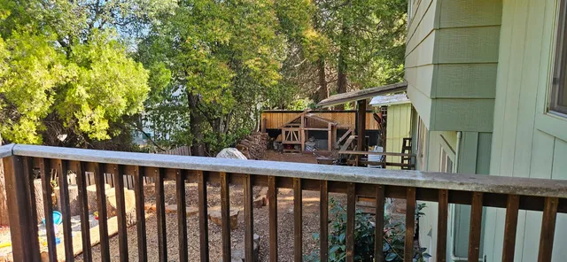 a view of deck and wooden fence