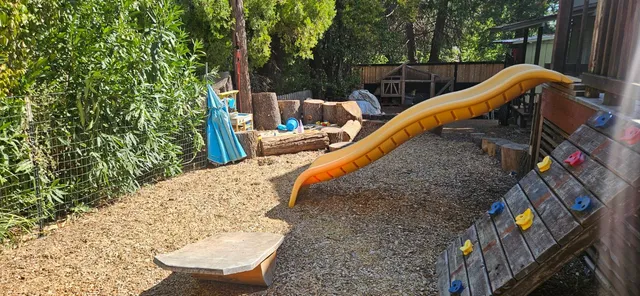 a view of a roof deck with two couches and wooden floor