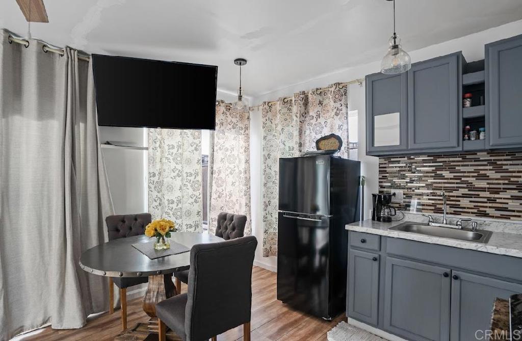 3964 Delta Street San Diego, CA 92113 - Photo 21 of 39 a kitchen with stainless steel appliances granite countertop a refrigerator and a stove top oven