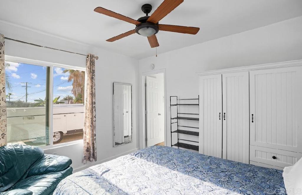 3964 Delta Street San Diego, CA 92113 - Photo 25 of 39 a bedroom with a bed and a window