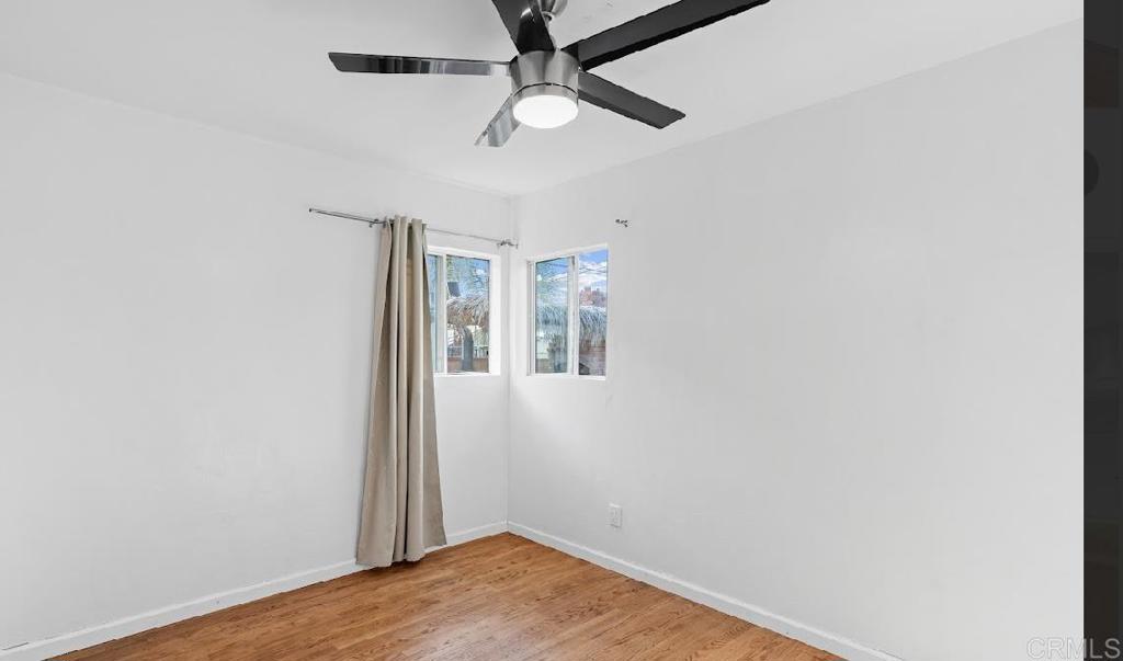 3964 Delta Street San Diego, CA 92113 - Photo 10 of 39 an empty room with a fan & a ceiling fan