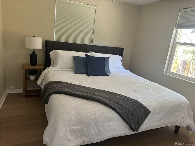 a bedroom with a bed and window