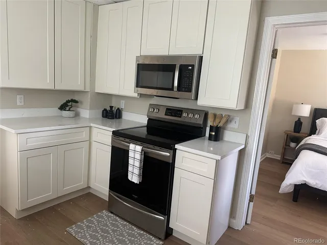 a kitchen with a stove and a microwave