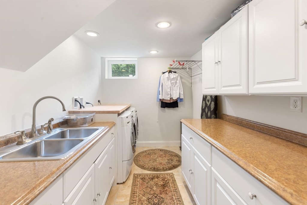 155 Adams Avenue Newton, MA 02465 - Photo 33 of 37 a kitchen with a sink and cabinets