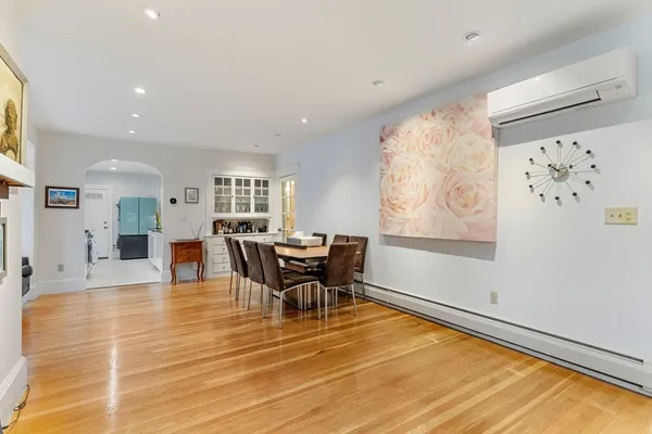 a view of a dining room with furniture and a rug