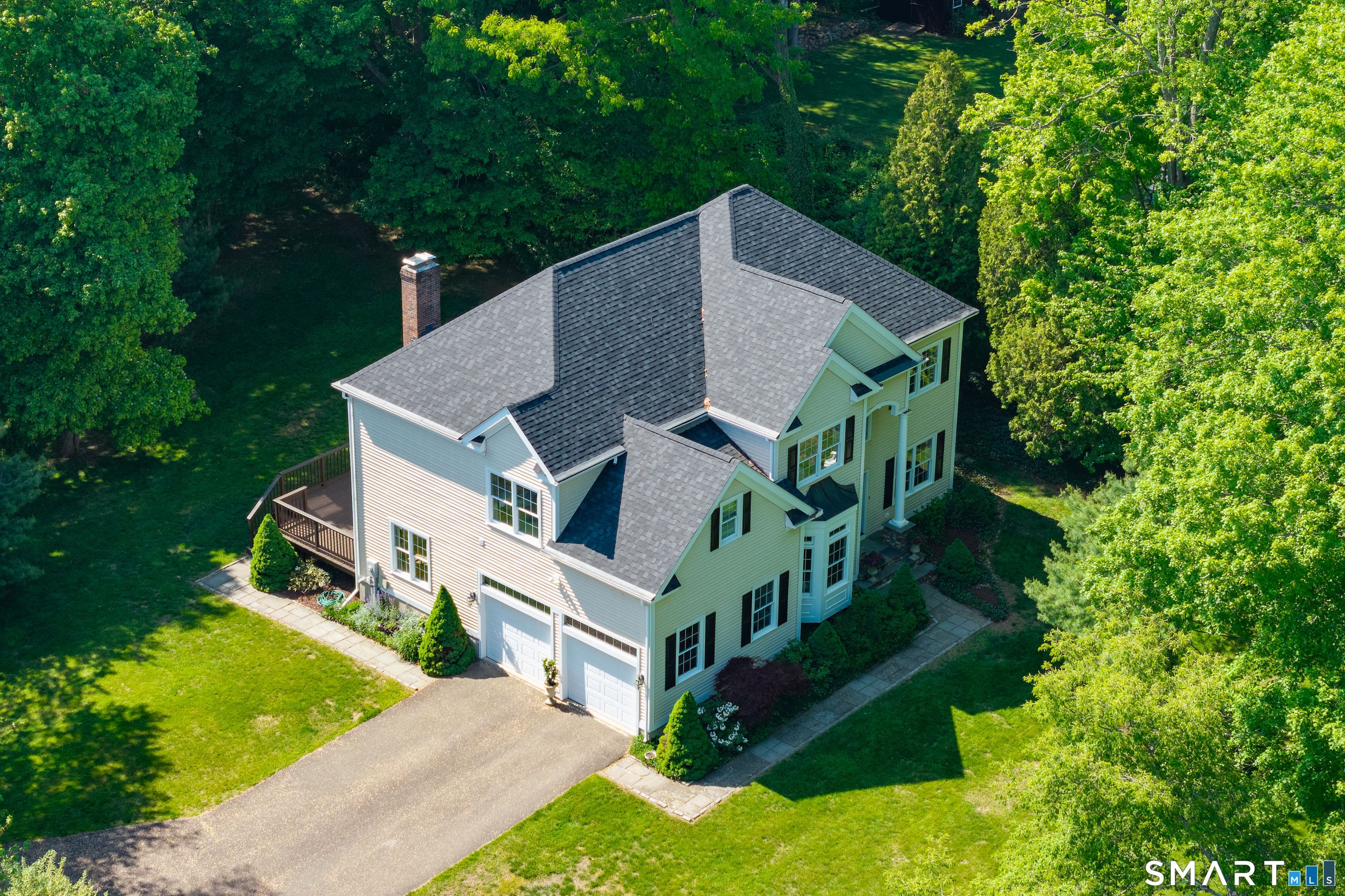 474 State Street Guilford, CT 06437 - Photo 4 of 40 a aerial view of a house with a big yard plants and large trees
