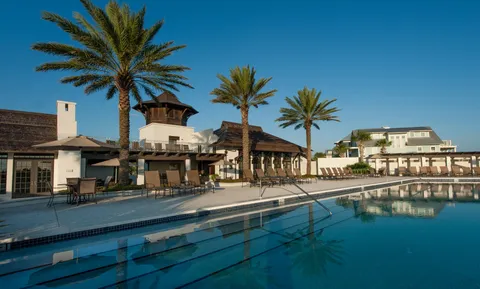 a view of a swimming pool with a lounge chairs
