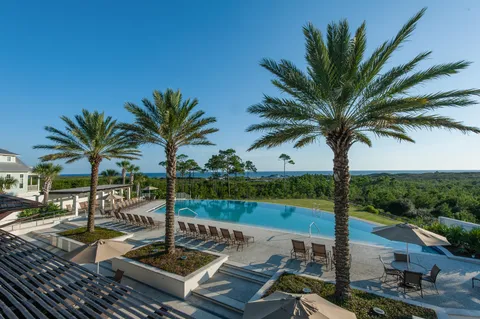 a view of a swimming pool with lounge chairs