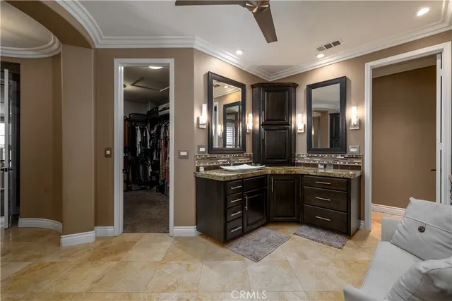 a spacious bathroom with a vanity and a mirror