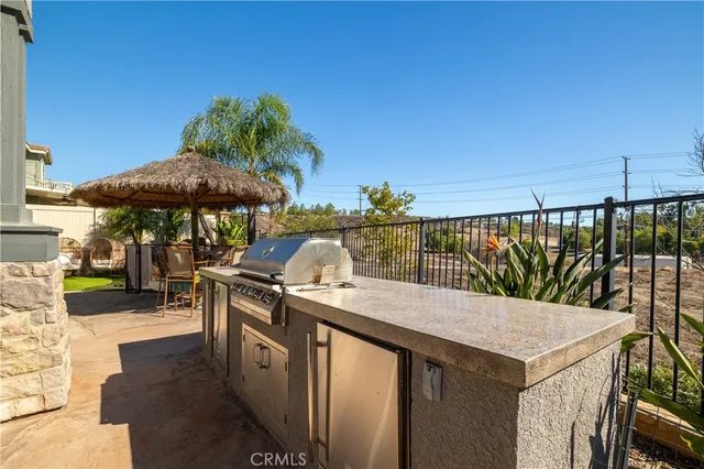 a terrace with outdoor seating and city view