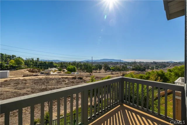 a view of city and mountain from a balcony