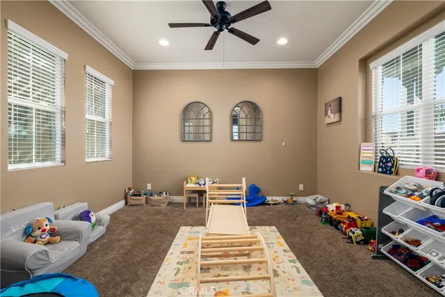 a bed room with a bed mirror and a window