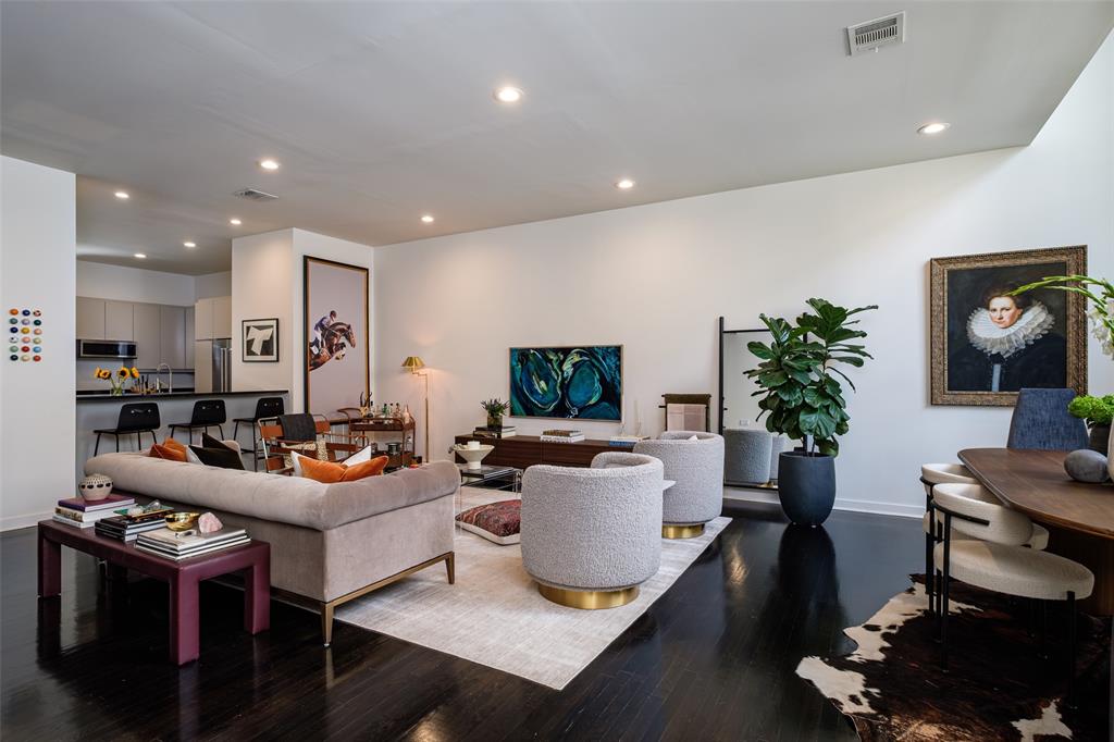 a living room with furniture fireplace and potted plant