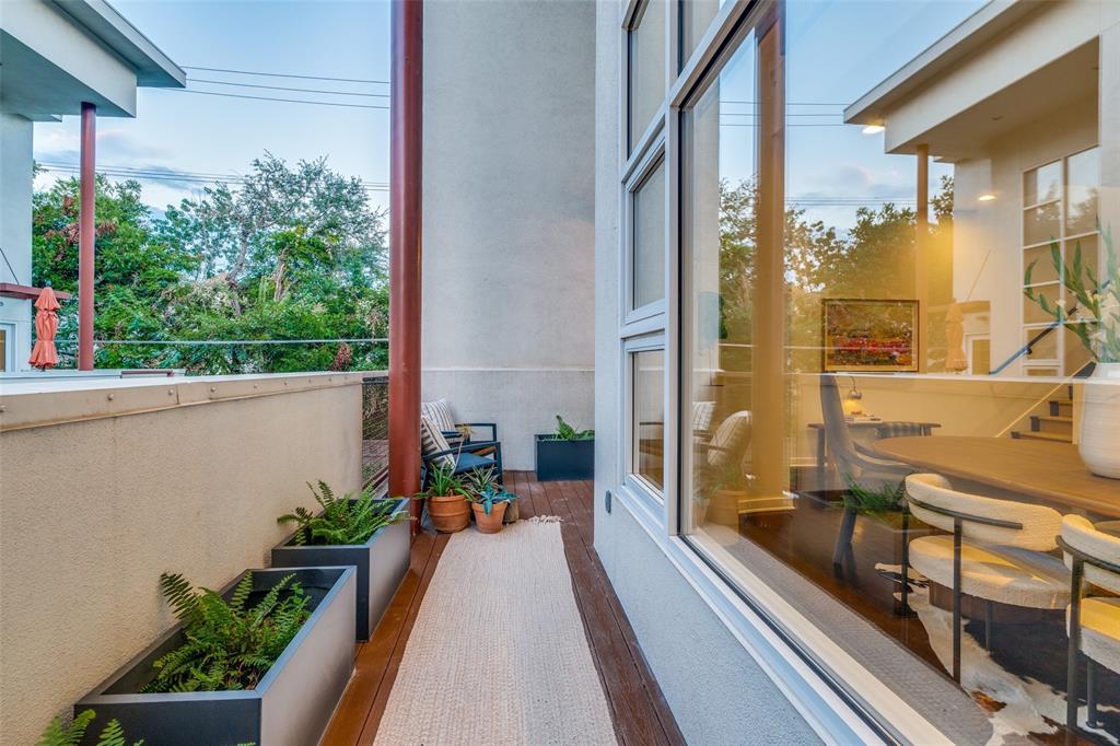 4014 Travis Street, Unit C Dallas, TX 75204 - Photo 11 of 23 a view of a balcony with potted plants