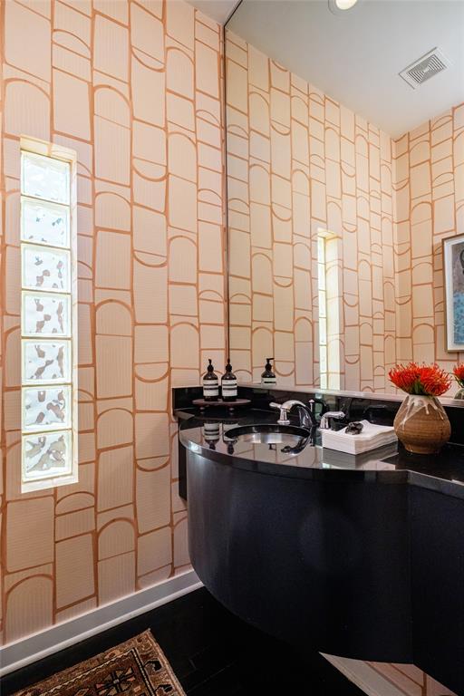 4014 Travis Street, Unit C Dallas, TX 75204 - Photo 12 of 23 a bathroom with a sink a toilet and shower curtain