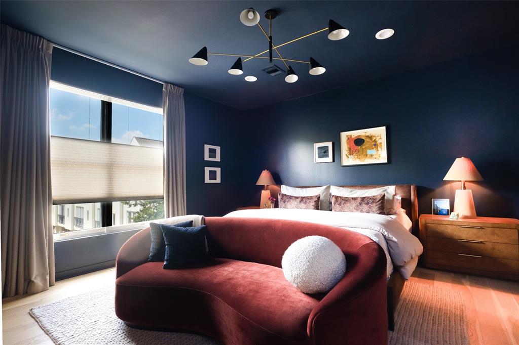 4014 Travis Street, Unit C Dallas, TX 75204 - Photo 13 of 23 a bedroom with a bed and a lamp