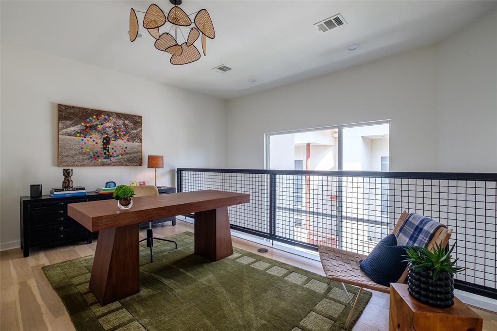 4014 Travis Street, Unit C Dallas, TX 75204 - Photo 18 of 23 a room with furniture and a potted plant