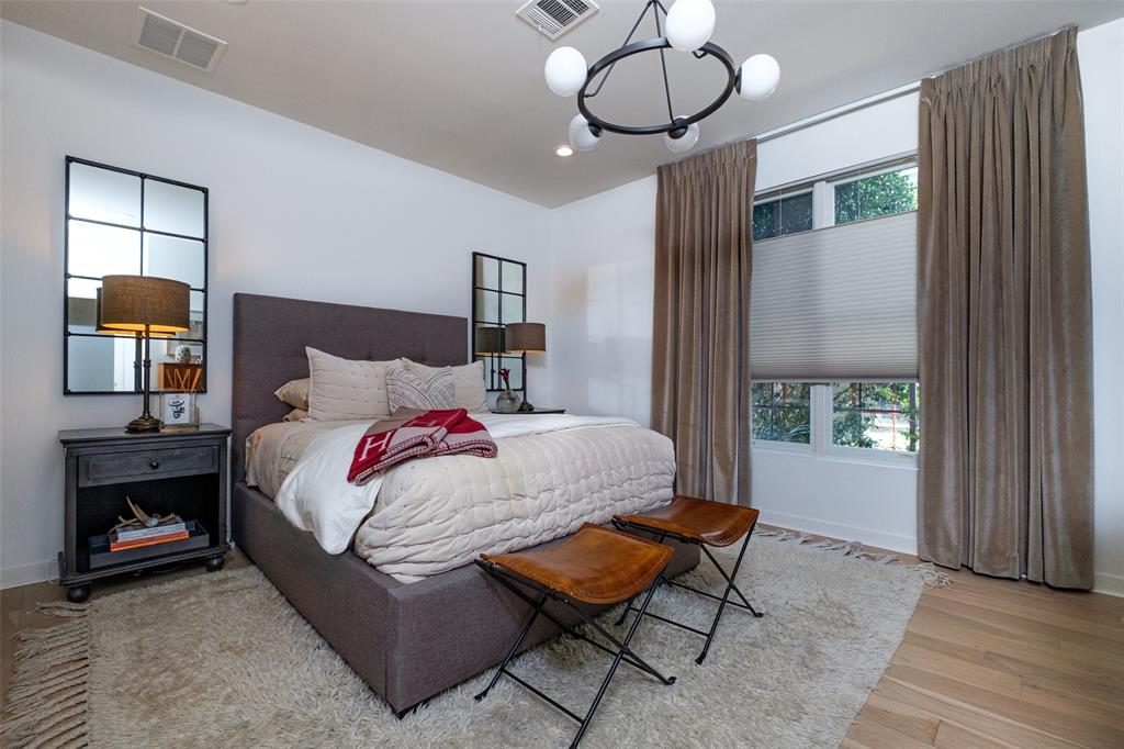 4014 Travis Street, Unit C Dallas, TX 75204 - Photo 4 of 23 a bedroom with a bed and window