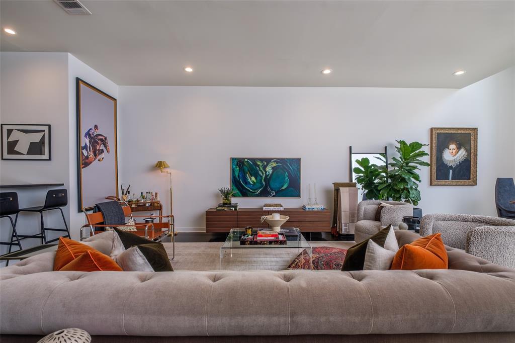 4014 Travis Street, Unit C Dallas, TX 75204 - Photo 6 of 23 a living room with furniture and a flat screen tv