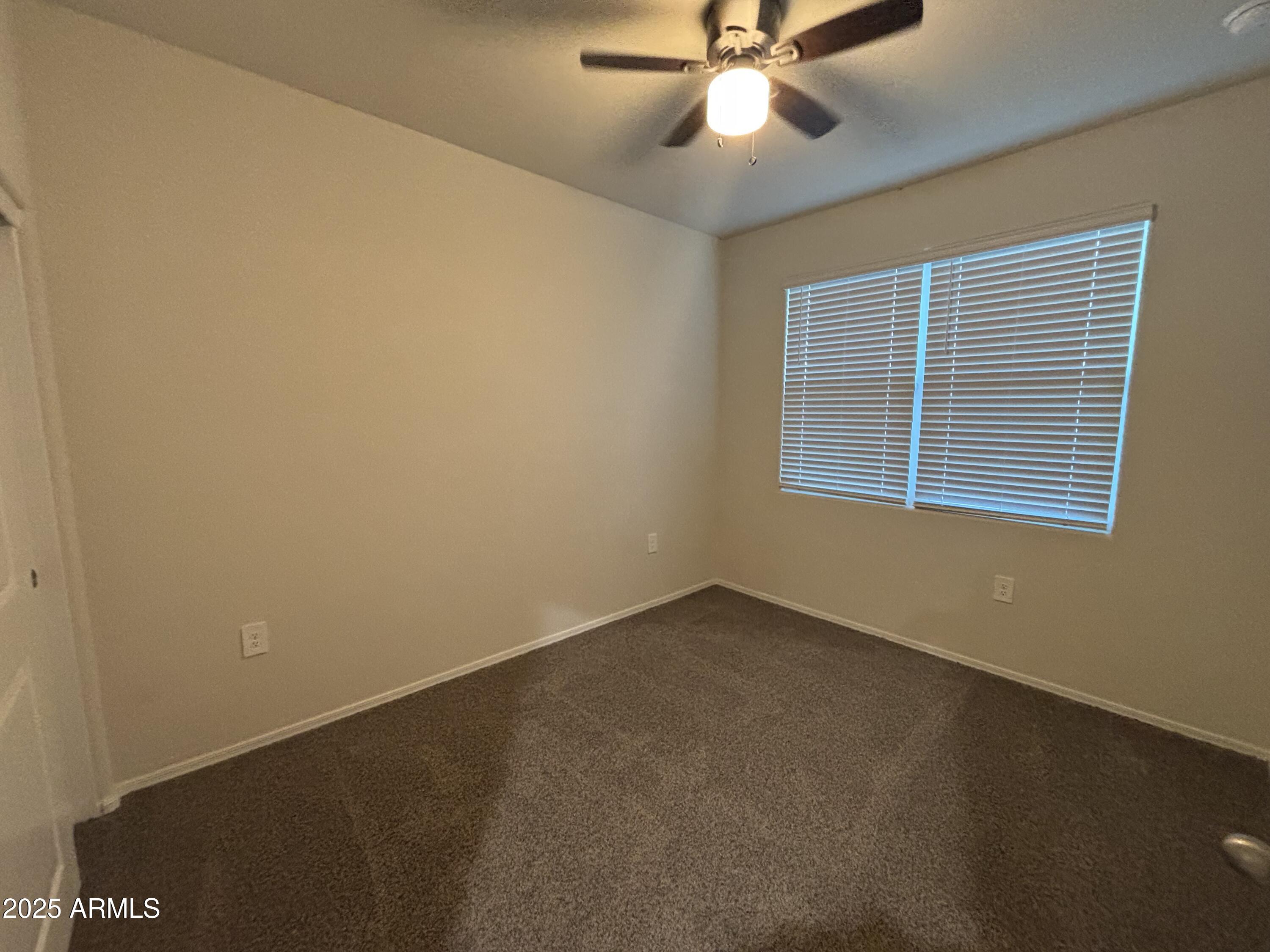 9345 Greenhouse Road Florence, AZ 85132 - Photo 11 of 13 a view of an empty room with a window