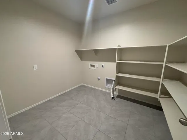 a view of room with racks on the wall