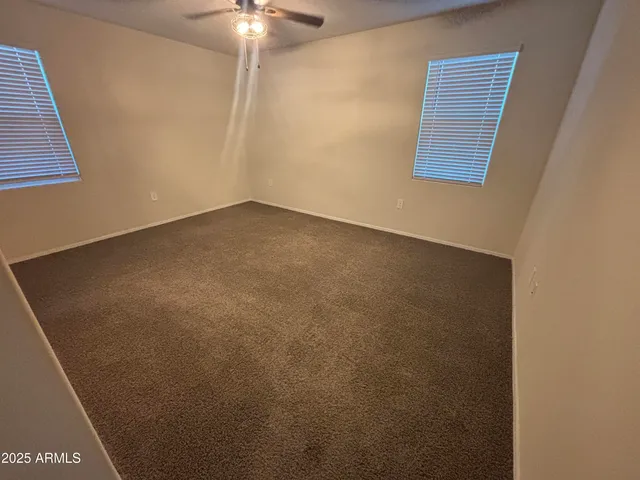 an empty room with a fan