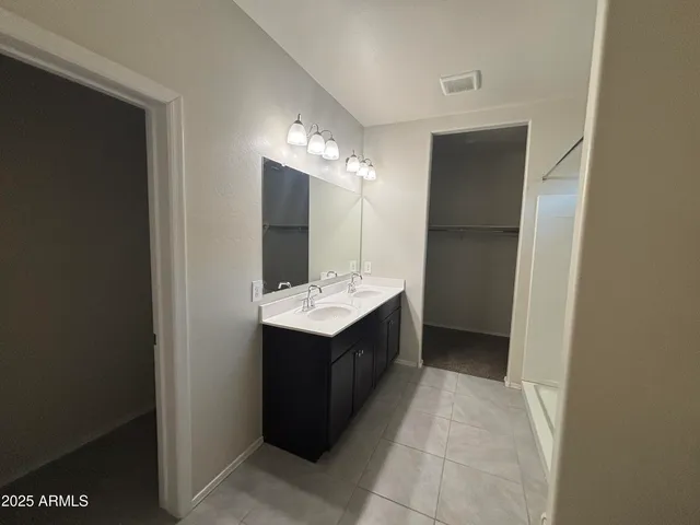 a bathroom with a sink and mirror