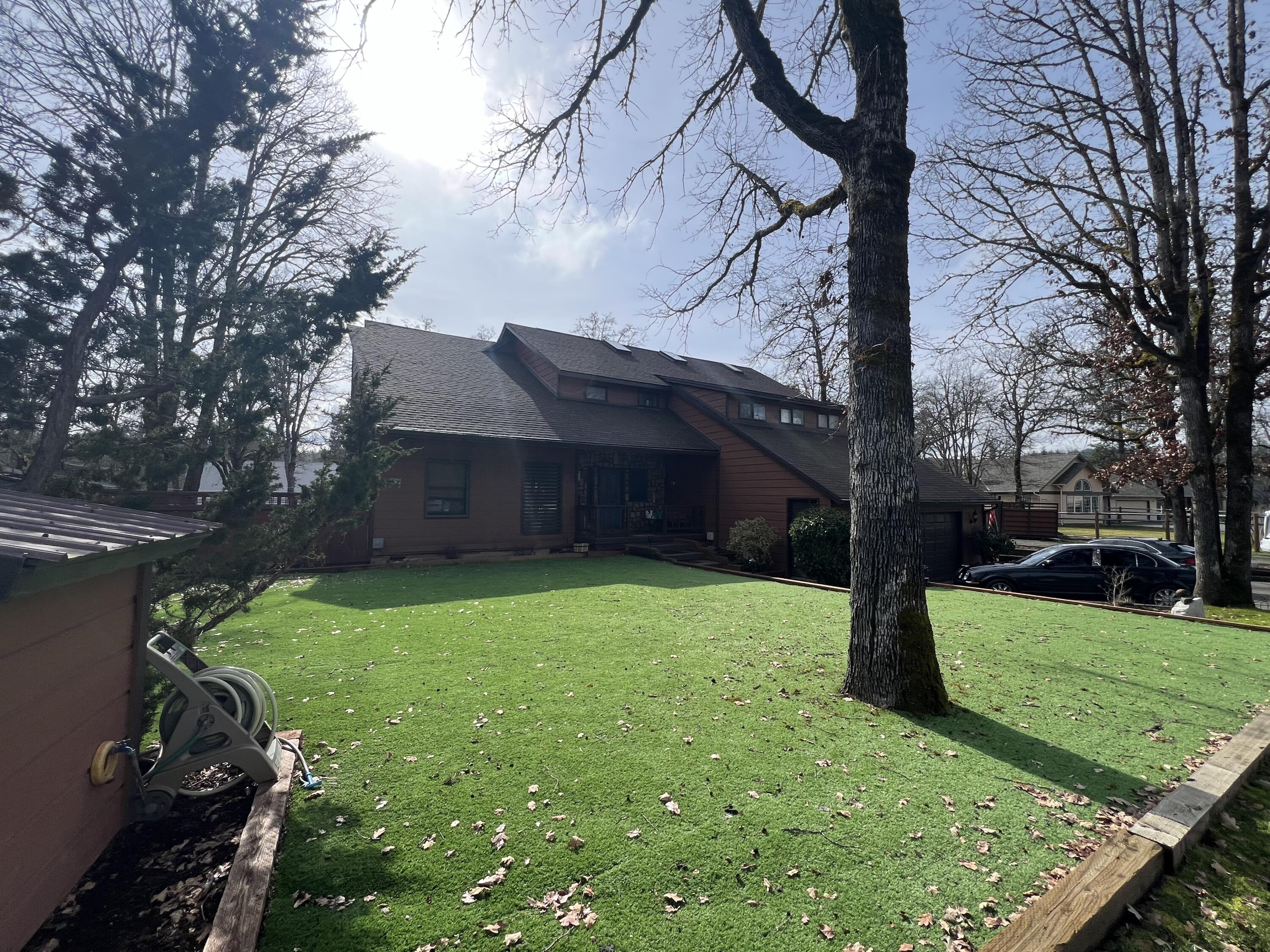 255 Barker Drive Merlin, OR 97532 - Photo 21 of 26 a view of a backyard with a large tree