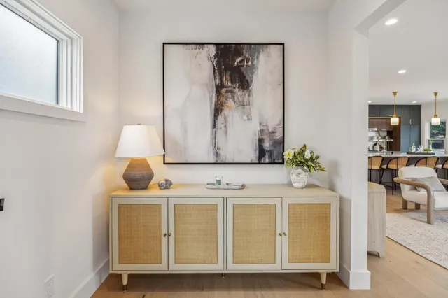 a bedroom with a bed and a lamp