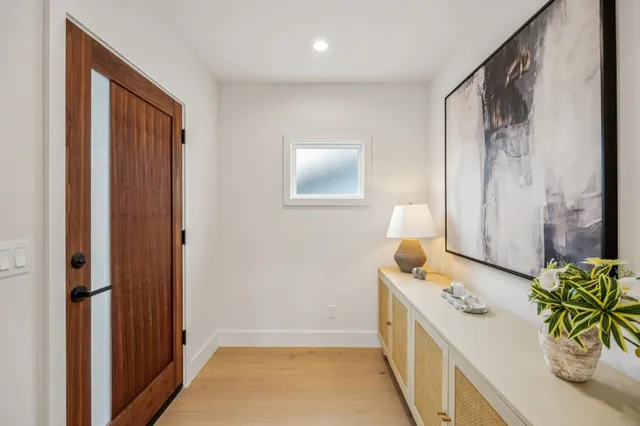 a bathroom with double vanity sinks and a granite